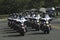 A squad of police motorcycles drive down the street in Landover, Maryland