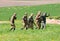 Squad of riflemen escorts POW