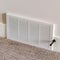 Square Air conditioner white plastic grille cover against wall and carpet floor