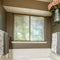 Square Alcove bathtub with deck mounted faucet near the window