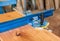 Square. Angle. Professional measuring tool in a carpentry workshop. On the desk