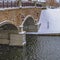 Square Arched bridge of a lake in Daybreak during winter