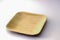 Square Areca Leaf Plate, eco-friendly disposable cutlery. Side view on a white background