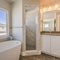 Square Bathroom interior with bathtub glass door shower and vanity area