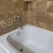 Square Bathtub with wall mounted handheld shower head and faucet