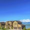 Square Beautiful facade of homes with landscaped lawns along a paved road