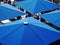 Square blue umbrellas above a cafe