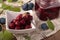 Square bowl of marinated berries of blackthorn