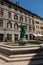 Square with buildings, restaurant and fountain, in ChambÃ©ry.