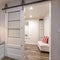 Square Built in banquette along the brown wood wall of a home with carpeted floor