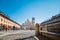 Square of the Cathedral of Sant`Ambrogio Duomo di Vigevano with people, long exposure, blue sky