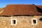 Square clay roof tiles house in Pyrenees Spain