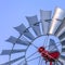 Square Close up of a steel windpump with pale blue sky in the background