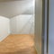 Square Closet space inside the loft of a three story townhome