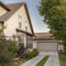 Square Concrete driveway leading to a double garage