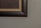 Square corners of a framed art work on a wall