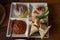 Square crockery plate with meze set of assorted pate and appetizers
