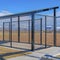 Square crop Baseball field dugout with slanted roof and chain link fence on a sunny day