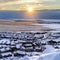 Square crop Beautiful sunrise in Draper Utah with snowy hills lake and houses in winter