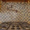 Square crop Cooktop and exhaust hood inside kitchen with faucet on the tile backsplash wall