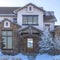 Square crop Facade of a home nestled at the residential community of Wasatch Mountains