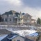 Square crop Homes on sunlit Wasatch Mountain slope blanketed with pristine snow in winter