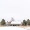 Square crop Scenic neighborhood with houses and trees covered with frost on snowy winter