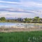 Square crop Utah lake shore panorama with distant houses