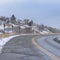 Square Damaged mountain road with directional road signs