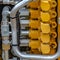 Square Details of a yellow construction machinery with close up on its engine