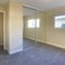 Square Empty bedroom with vacuumed carpet mirror doors