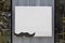 Square empty white canvas and mustache pattern on metallic wall with glass window