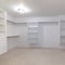 Square Empty white shelves in a fitted walk-in wardrobe