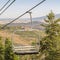 Square Focus on an empty chairlift against summer landscape of ski resort in Park City