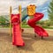 Square Focus on empty childrens playground at a park with red slides and climbing bars