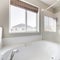 Square frame Bathroom interior with bathtub, shower stall and window