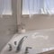 Square frame Bathroom interior with close up view of the gleaming built in bathtub