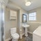 Square frame Bathroom and laundry room with shower stall and wall cabinets