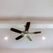 Square frame Ceiling fan with wood blades and built in lights on the ceiling beam of home