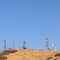 Square frame Communication towers on a mountain top day light