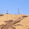 Square frame Group of communications towers on a hilltop