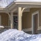 Square frame Home on mountainside residential community with porch and front door with wreath