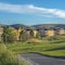 Square frame Houses around a golf course with scenic background of mountain and blue sky