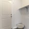 Square frame Interior of a laundry room with shelf and woven basket