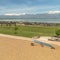 Square frame Lake and snow capped mountain viewed fron a park with colorful playground set