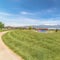 Square frame Park with basketball court pavilion and playground overlooking lake and mountain