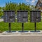 Square frame Row of cluster mailboxes with numbered compartments on the sidewalk