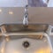 Square frame Shiny stainless steel sink and faucet on the gleaming kitchen countertop