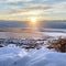 Square frame Snowed in hill overlooking frosted houses and lake in Draper Utah in winter