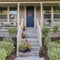 Square frame Steps to an elevated front door of a house